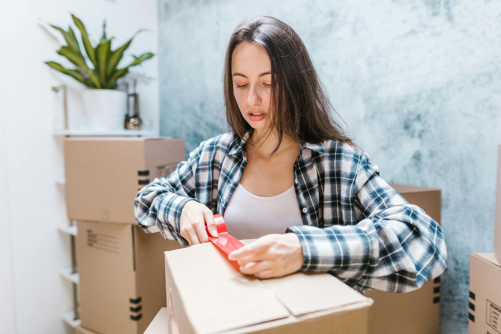 Woman packing boxes.