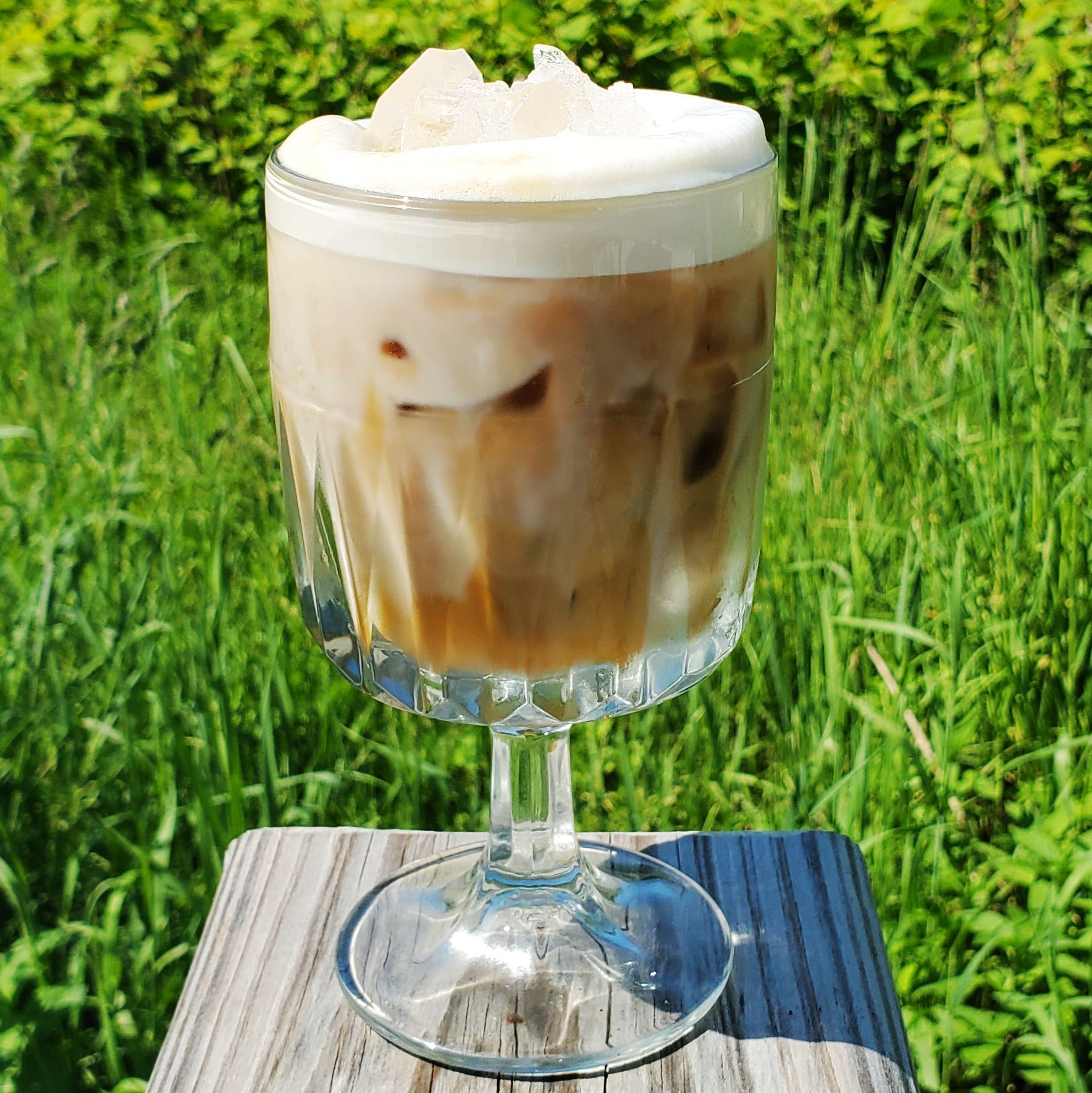 Iced latte in a glass cup