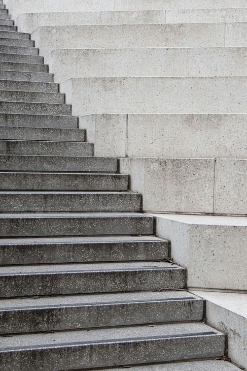 A set of concrete stairs leading up to a building.