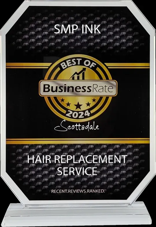 A plaque that says smp ink best of business rate hair replacement service