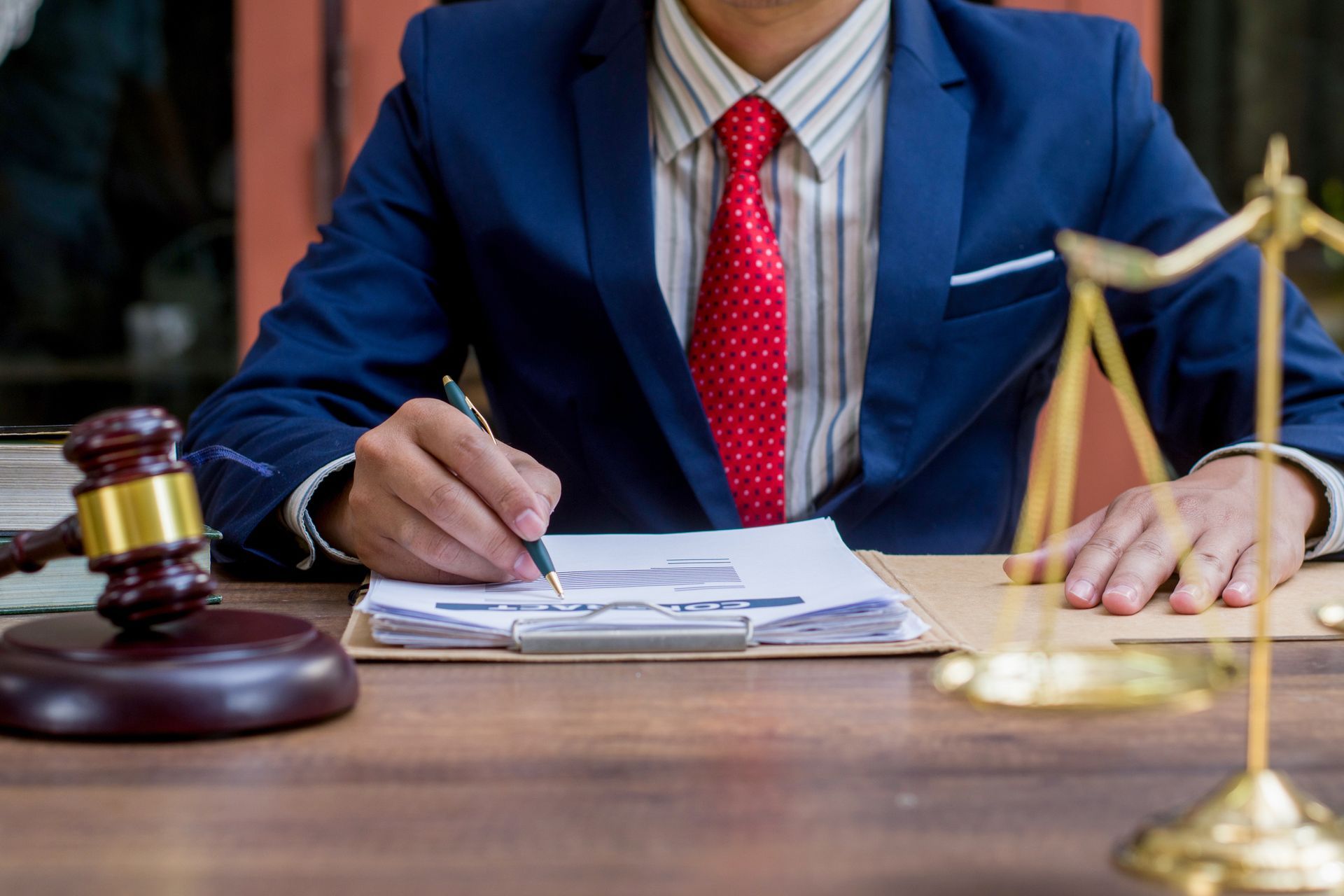 Close up lawyer businessman working or reading lawbook in office workplace