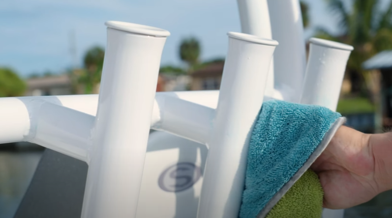 Blue towel-drying white fishing rod holders.