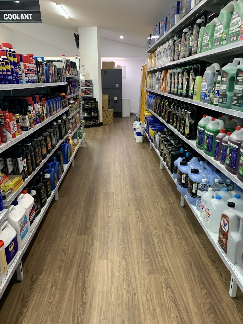 A Long Aisle In A Store Filled With Lots Of Products — Camden Haven Auto Parts In Bonny Hills, NSW