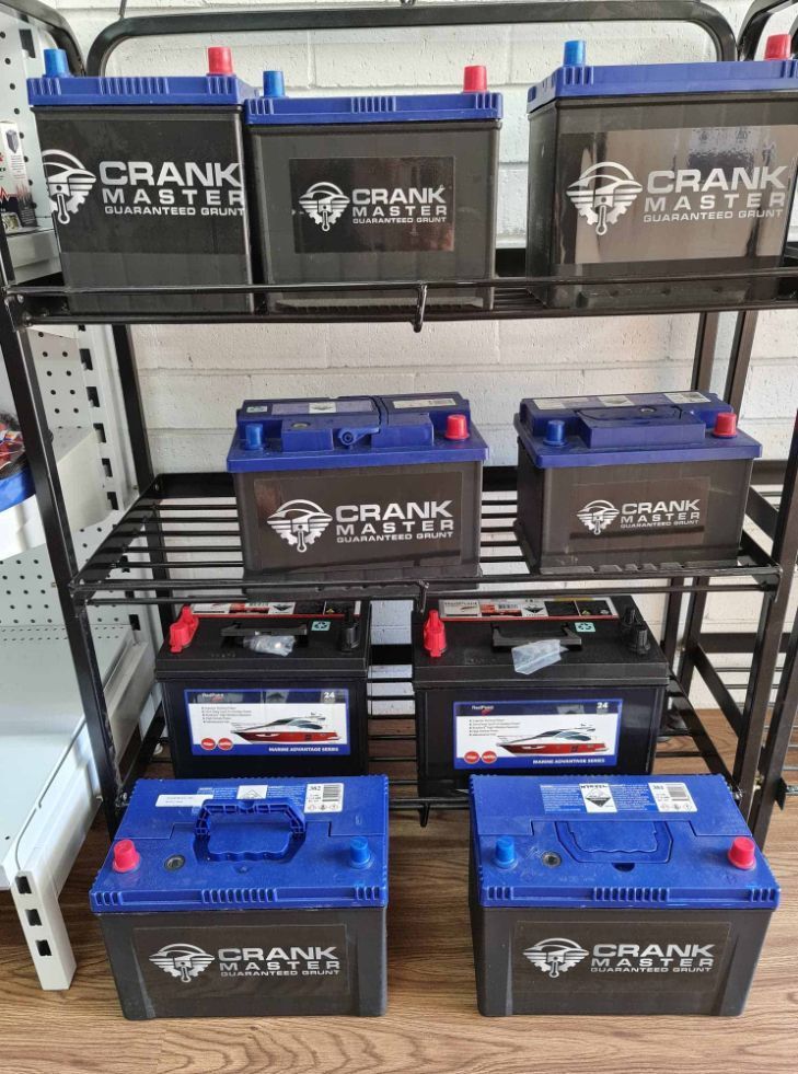 A Bunch Of Batteries Are Sitting On Top Of A Shelf — Camden Haven Auto Parts In Laurieton, NSW