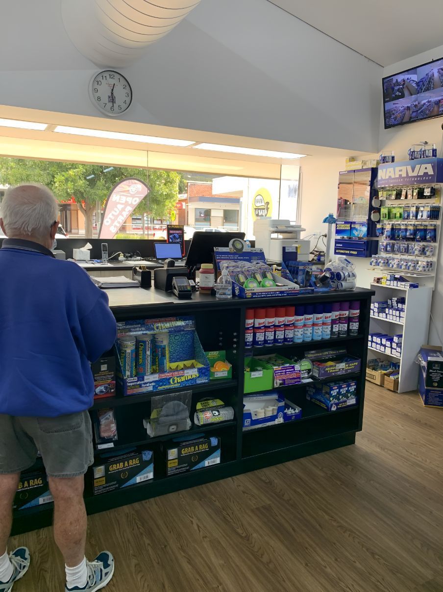 A Man Is Standing In Front Of A Counter In A Store — Camden Haven Auto Parts In Laurieton, NSW