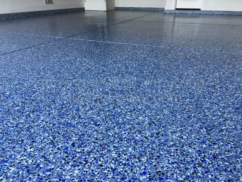 Blue speckled epoxy flooring in Traverse City, MI
