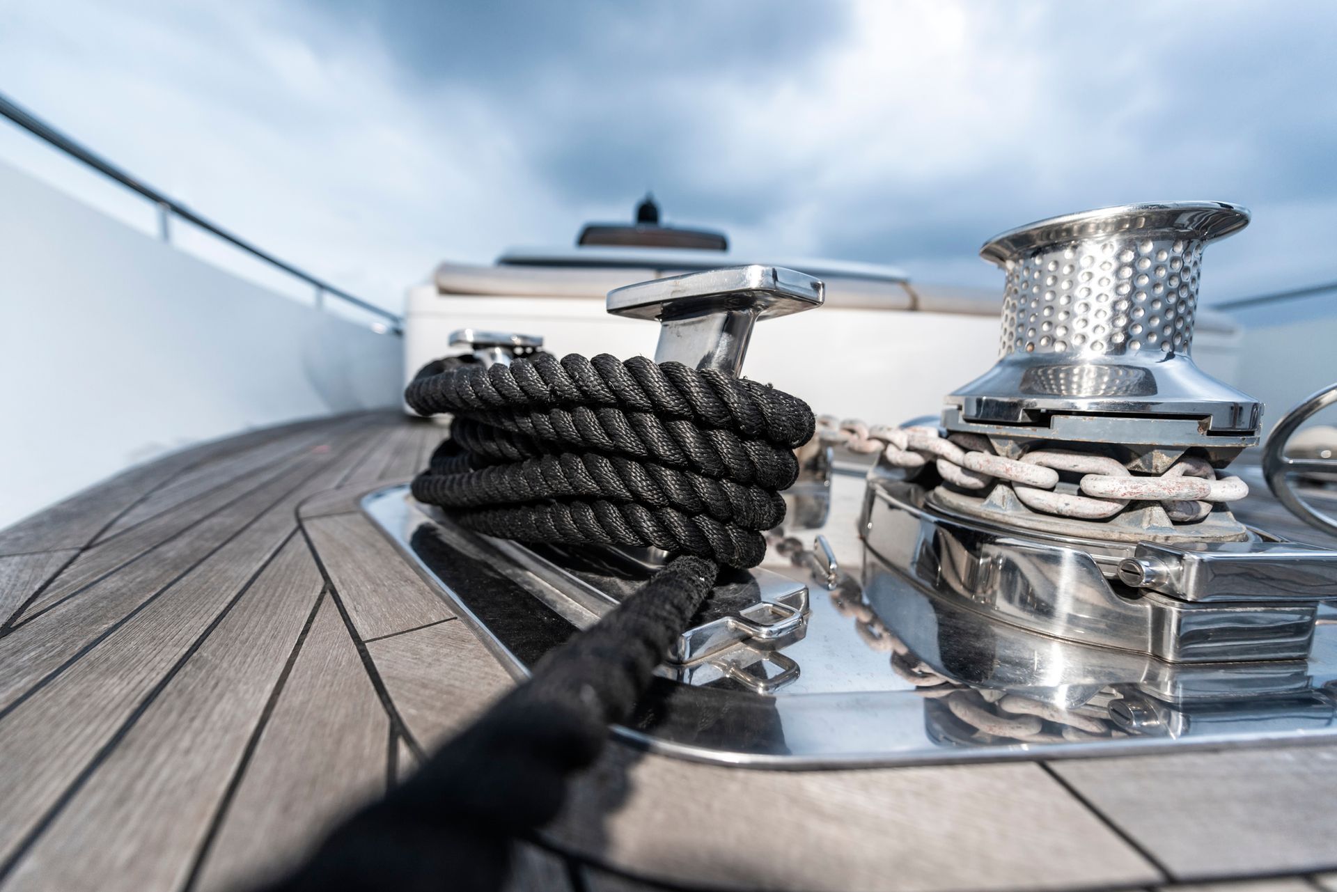 A boat with a rope and a winch on the deck