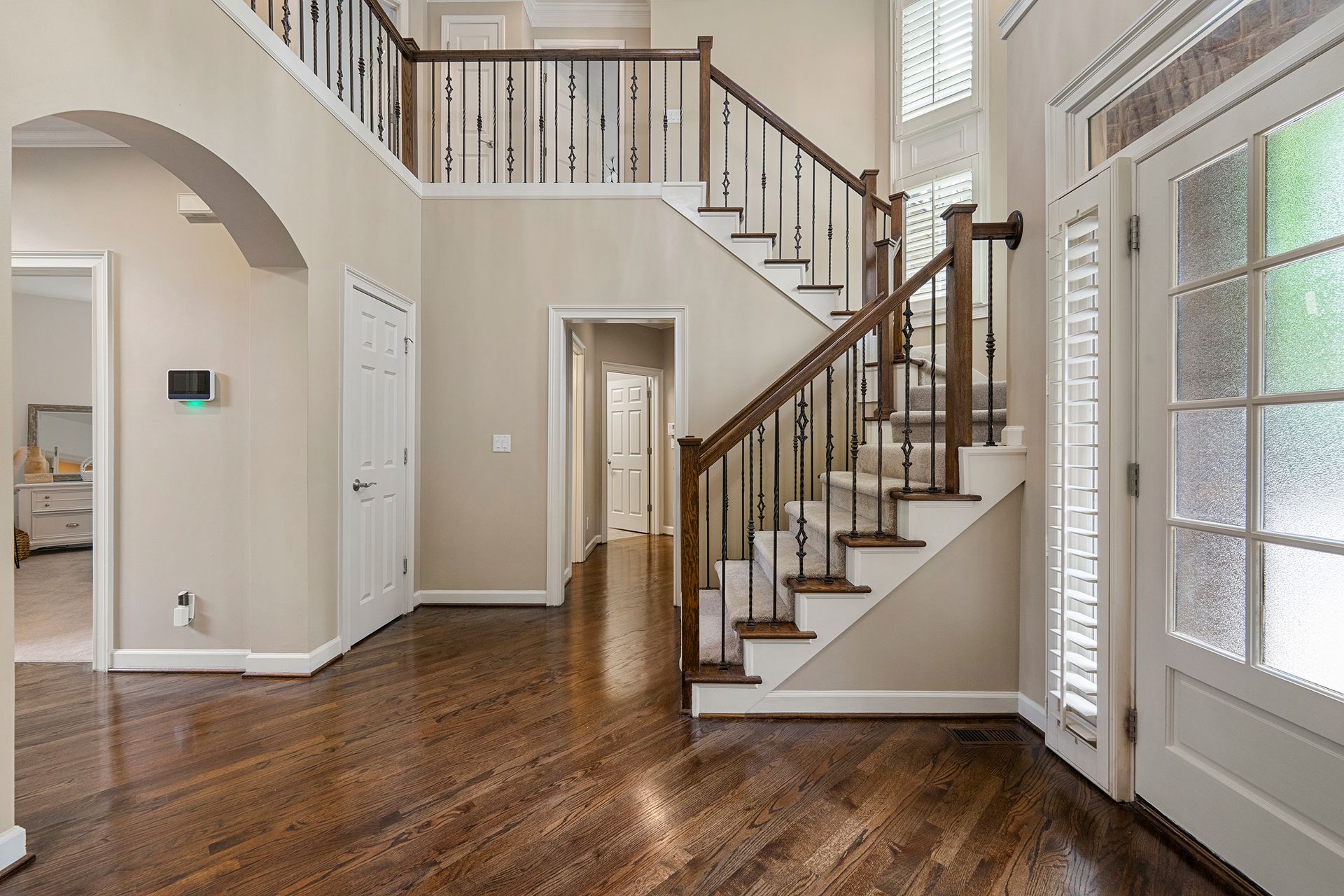 There is a staircase in the middle of the hallway.