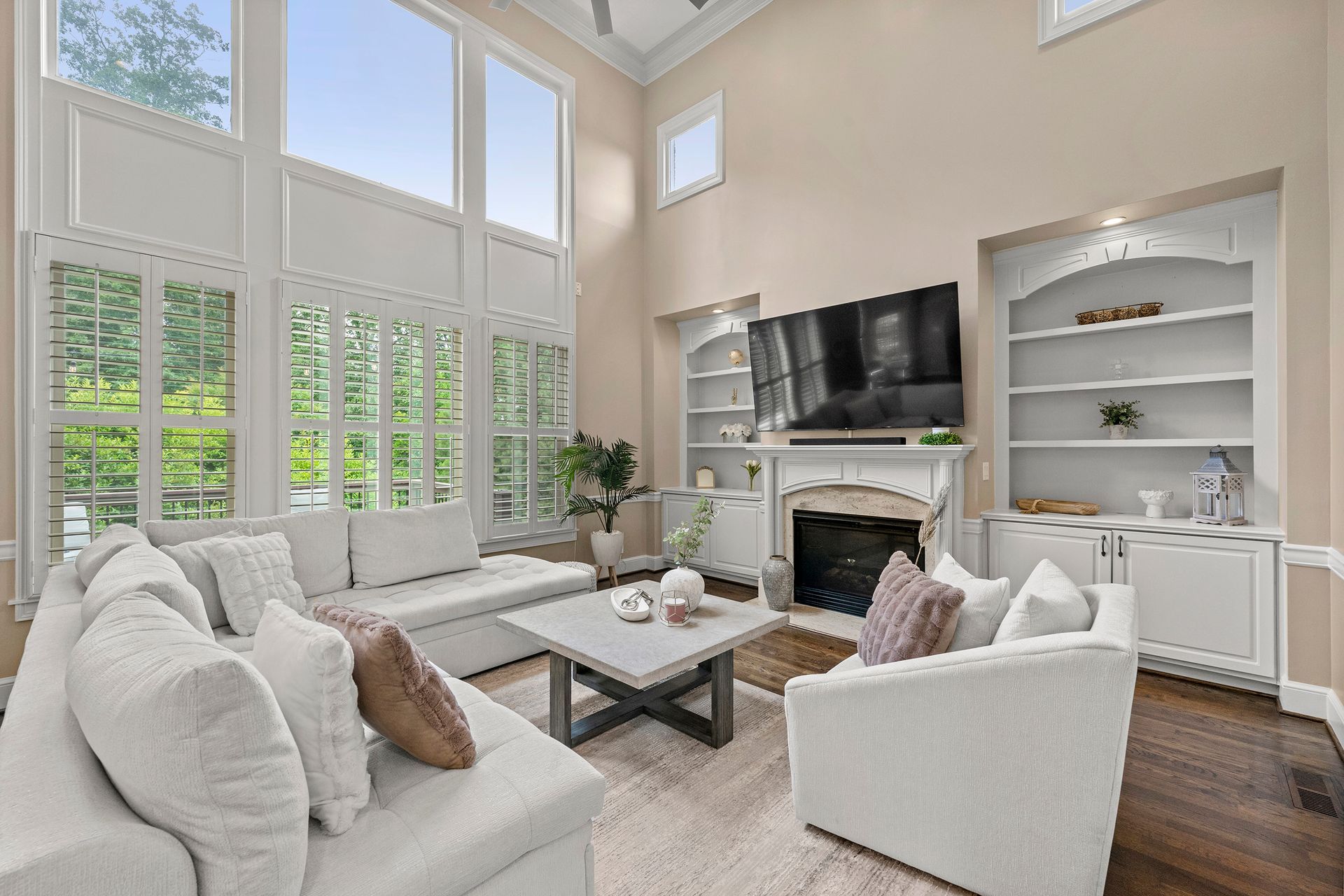 A living room filled with furniture and a fireplace.