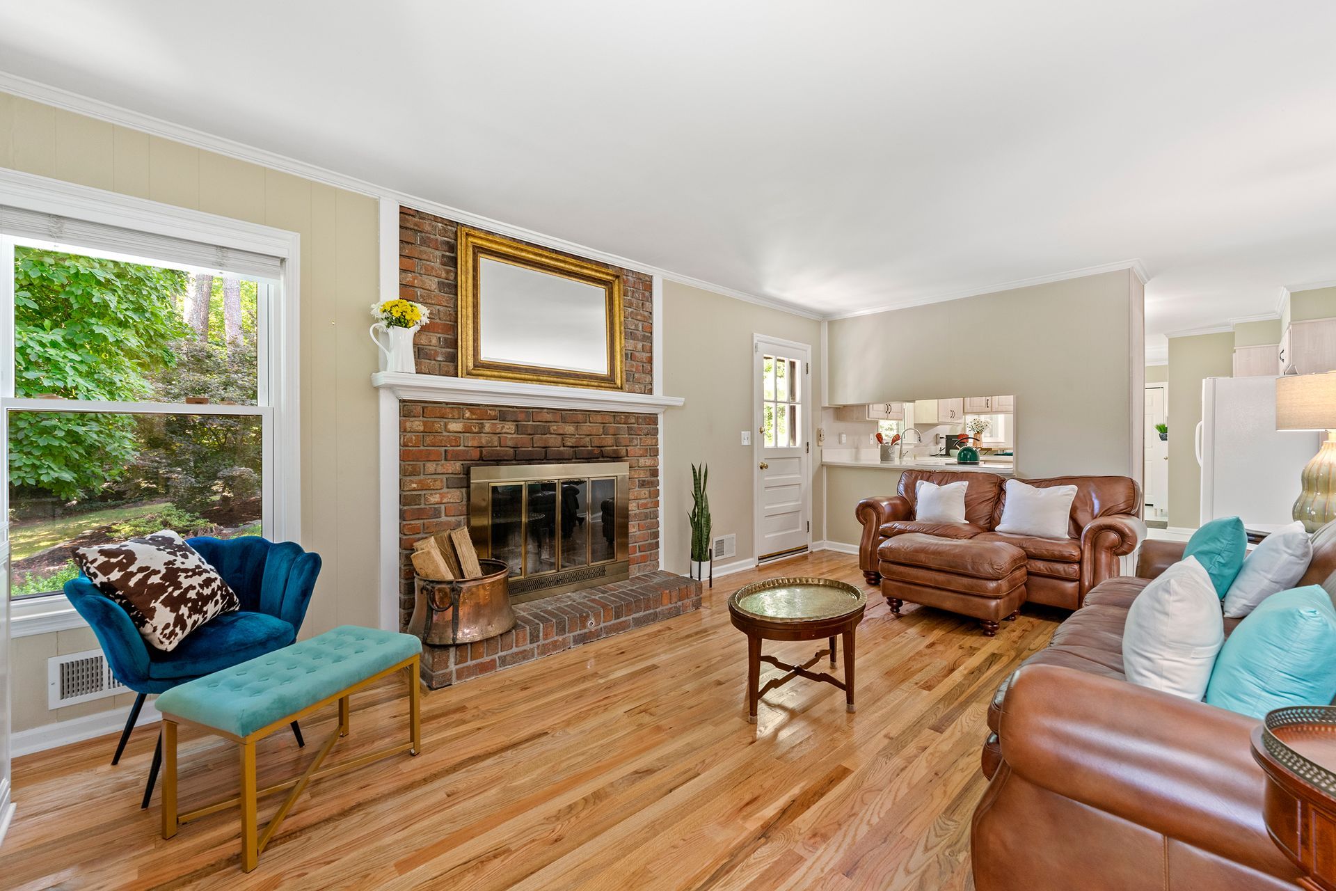 A living room filled with furniture and a fireplace.