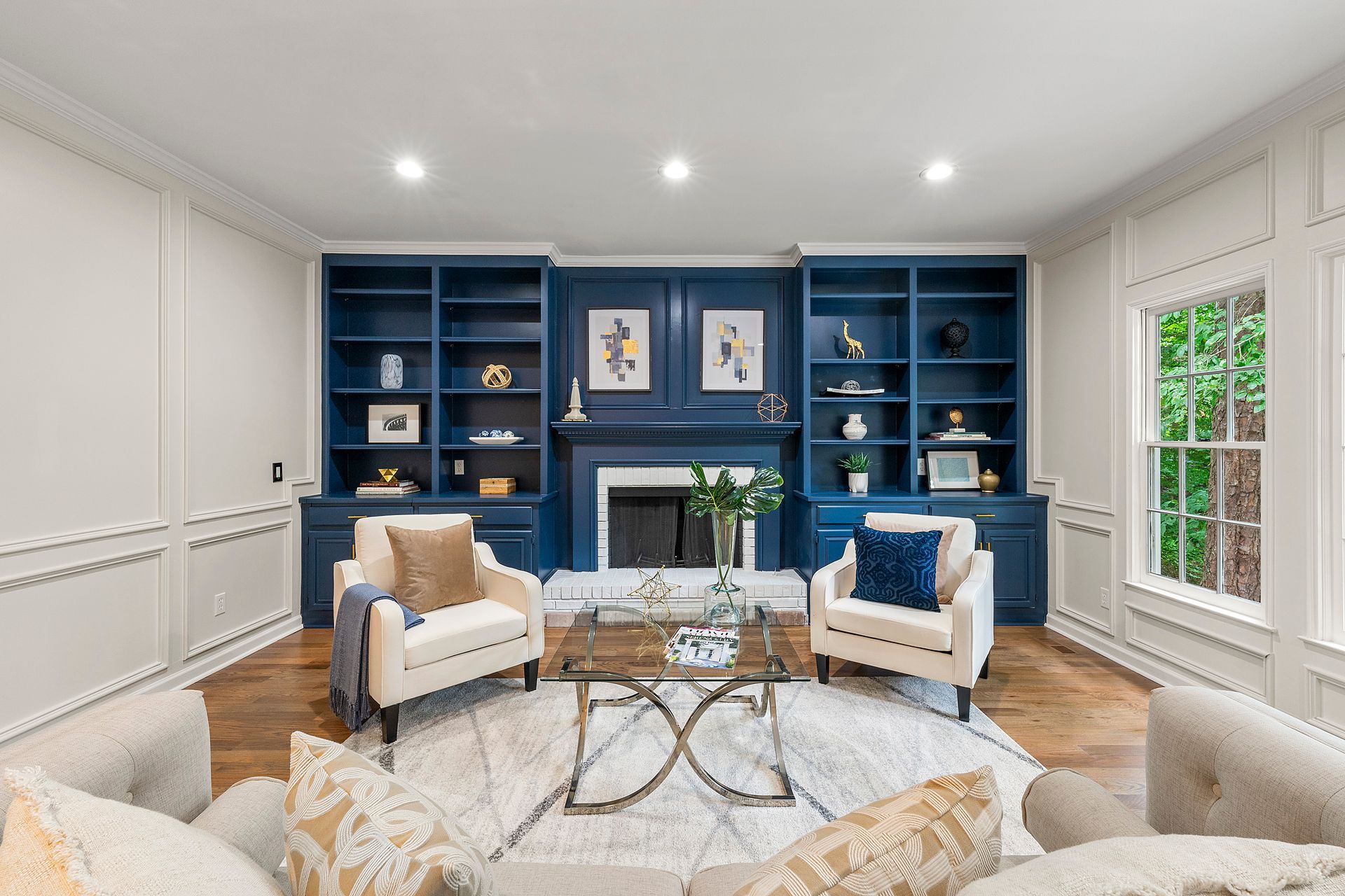 A living room filled with furniture and a fireplace.
