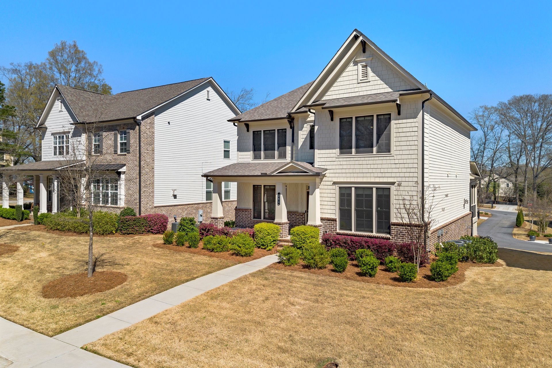 A couple of houses sitting next to each other on a sunny day.