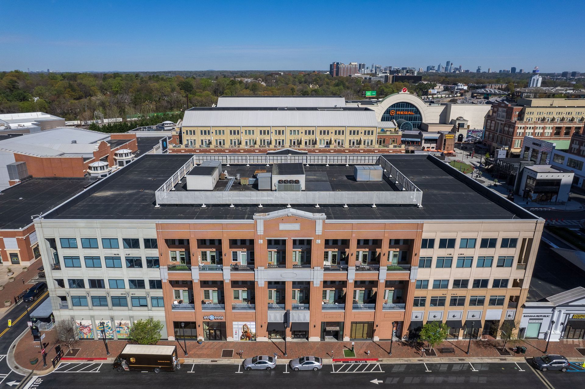 An aerial view of a large brick building in a city