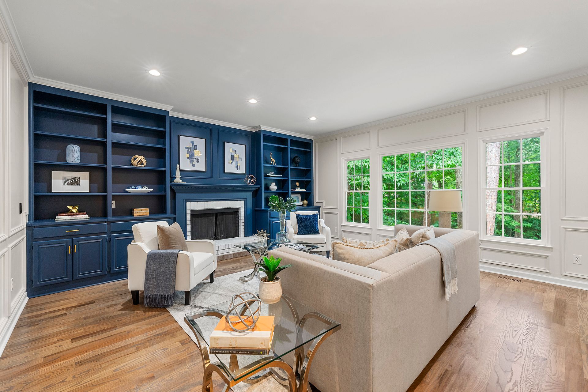 A living room filled with furniture and a fireplace.