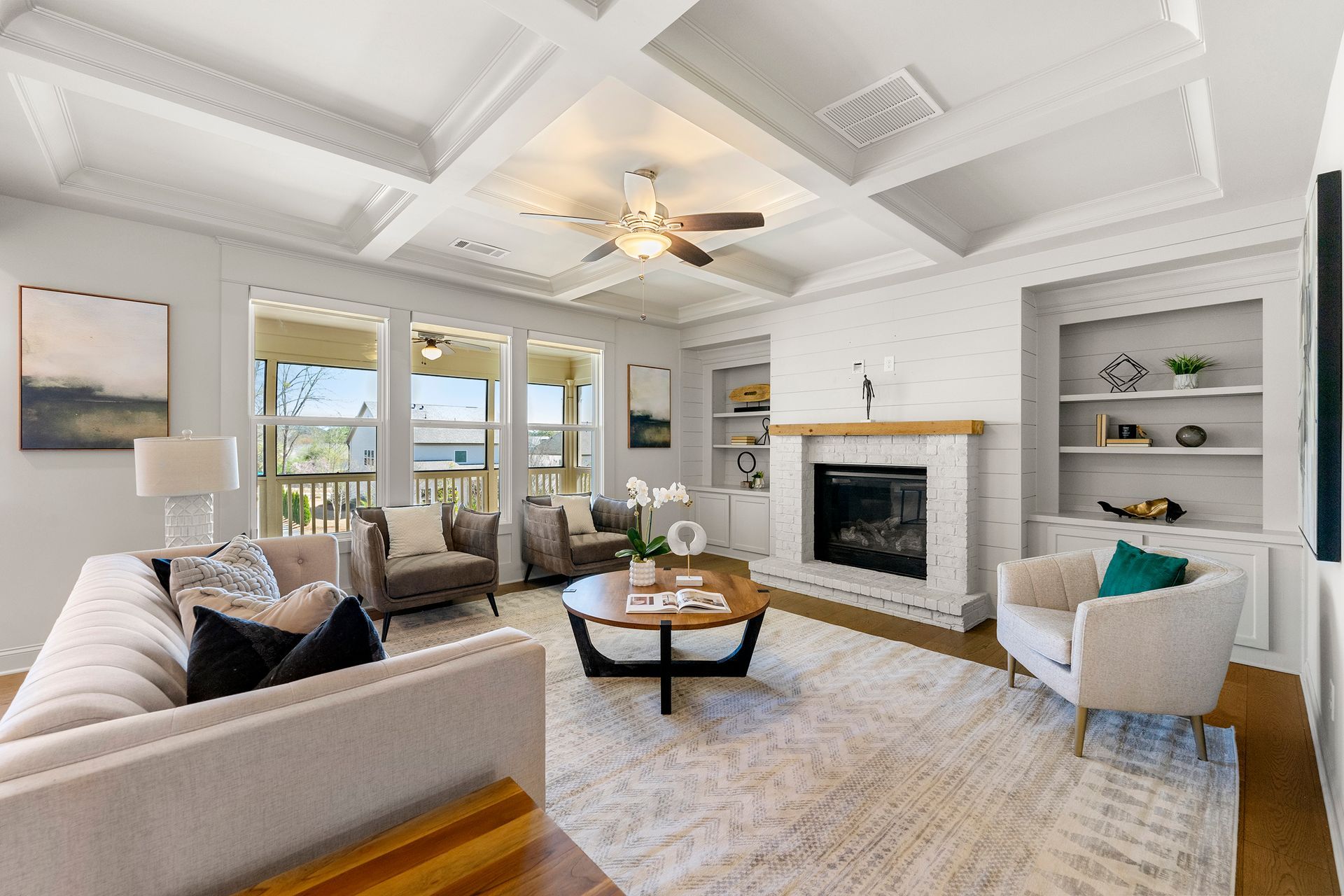 A living room filled with furniture and a fireplace.