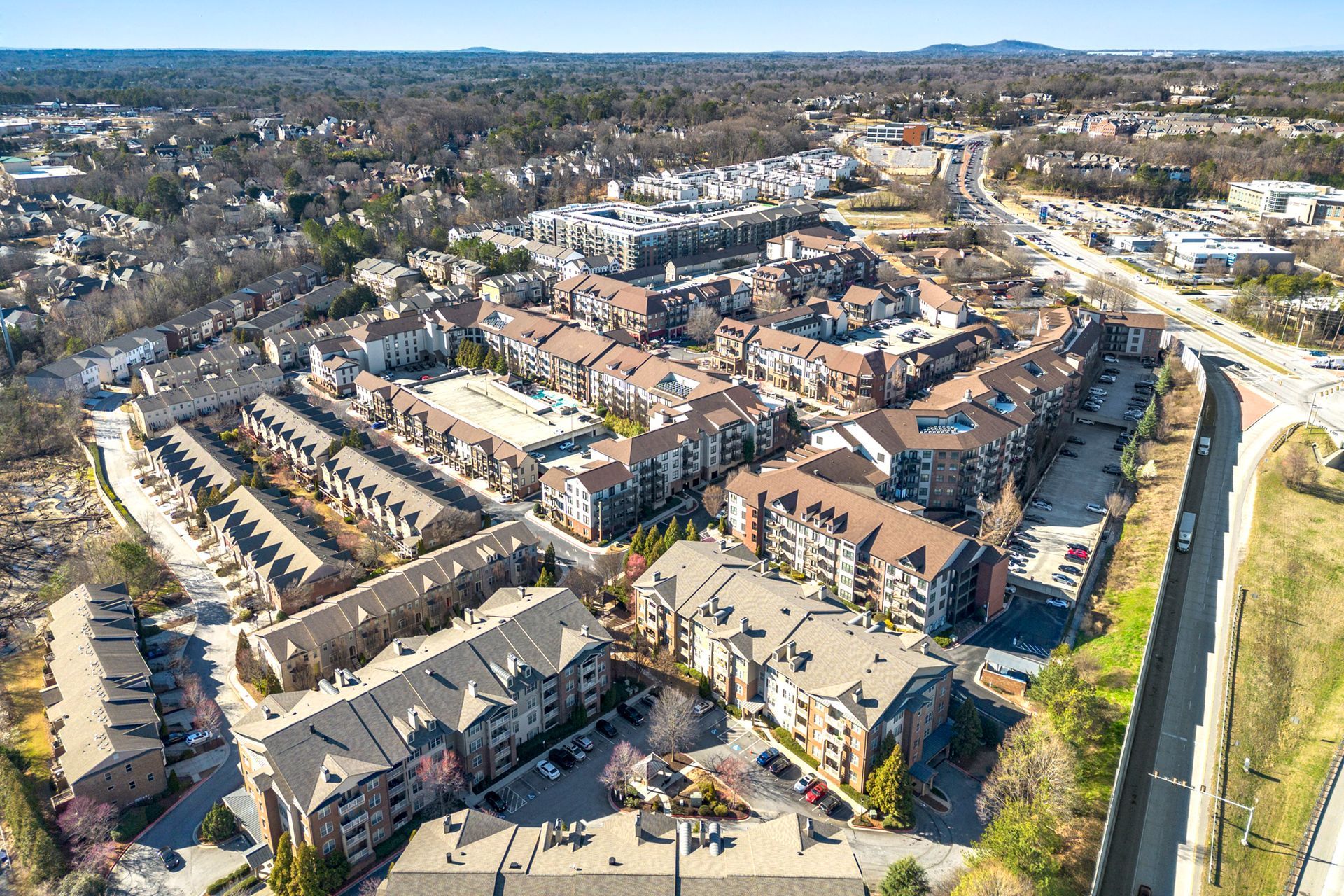 An aerial view of a large apartment complex in a city.