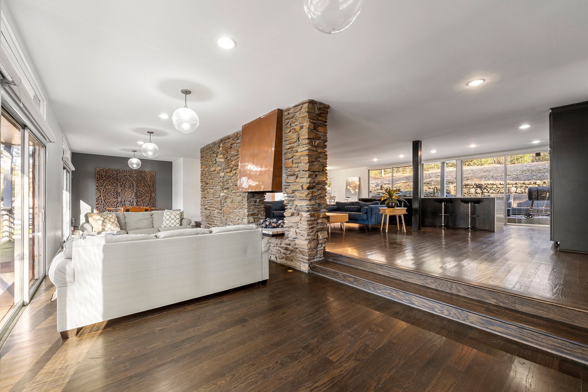 A living room filled with furniture and a fireplace.