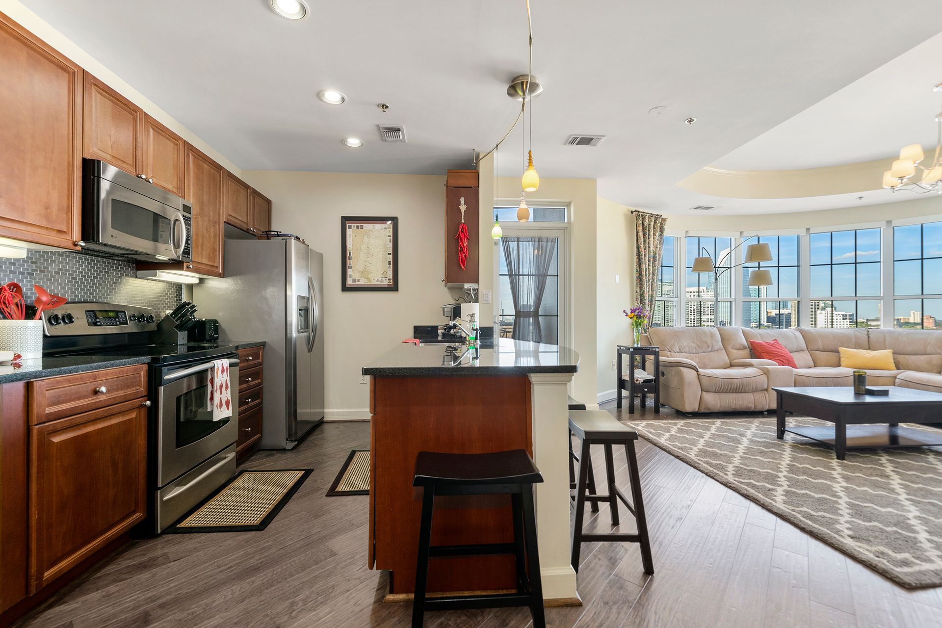 A kitchen with stainless steel appliances and wooden cabinets