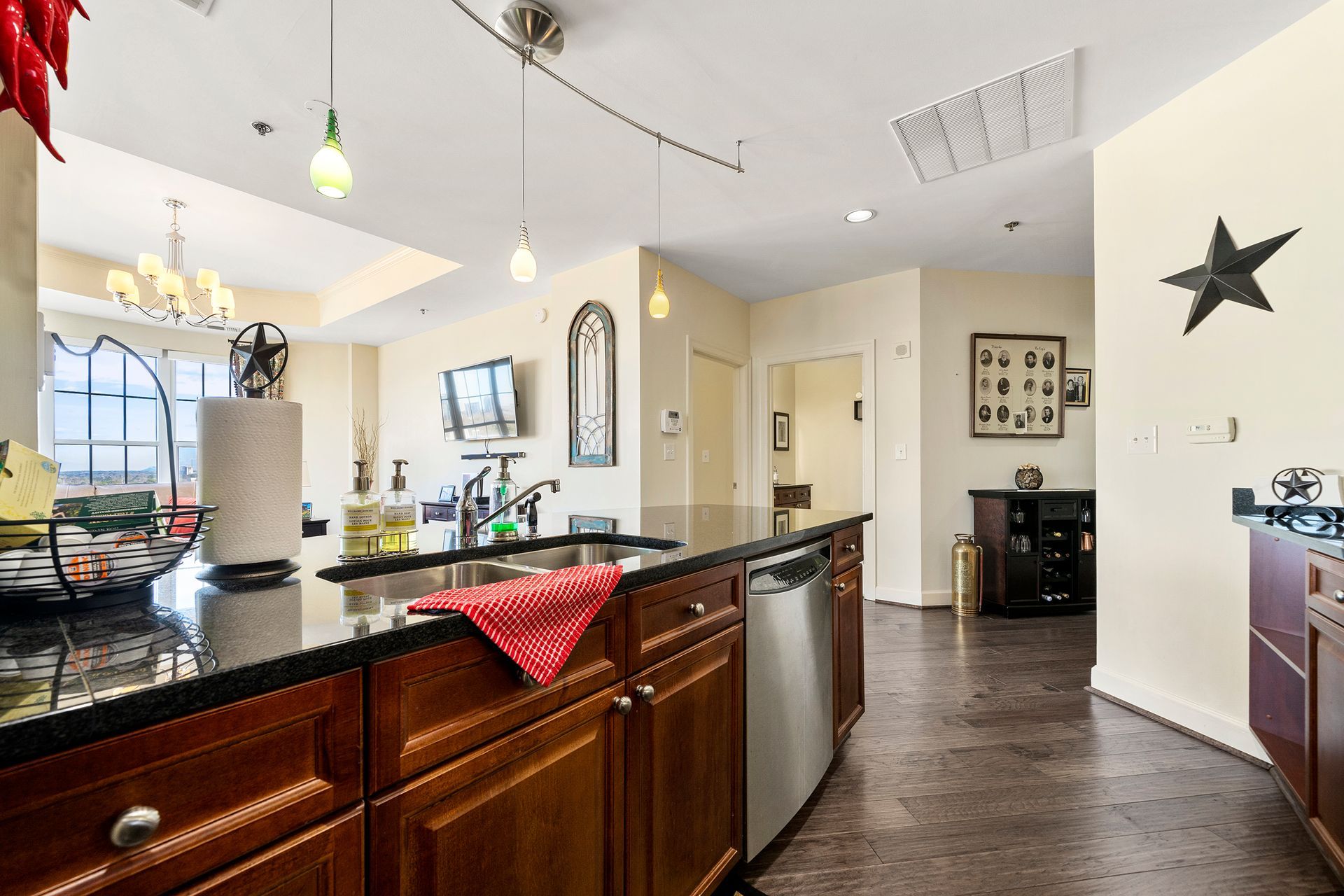 A kitchen with a large island and stainless steel appliances