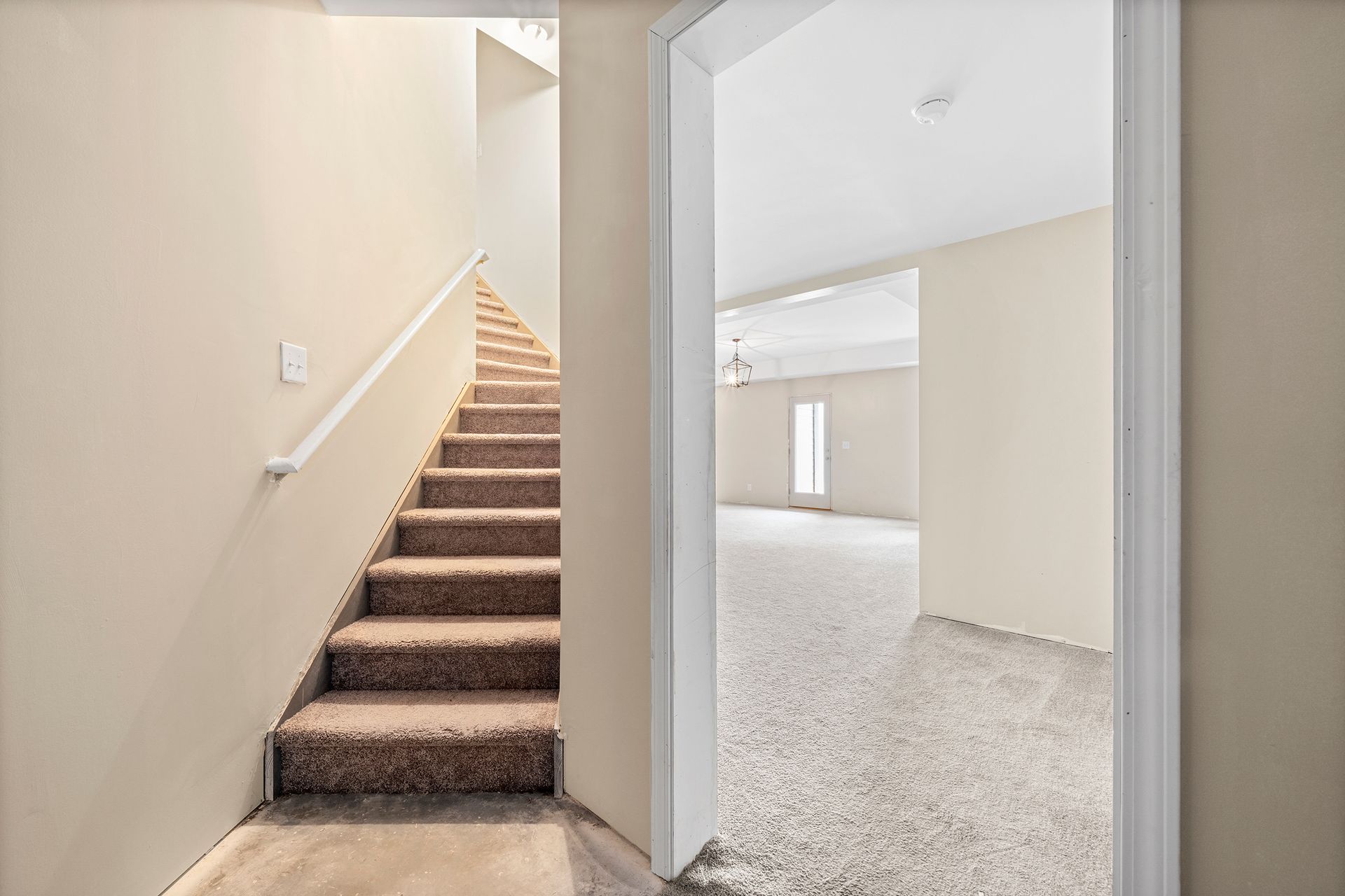 There is a staircase leading up to the second floor of a house.