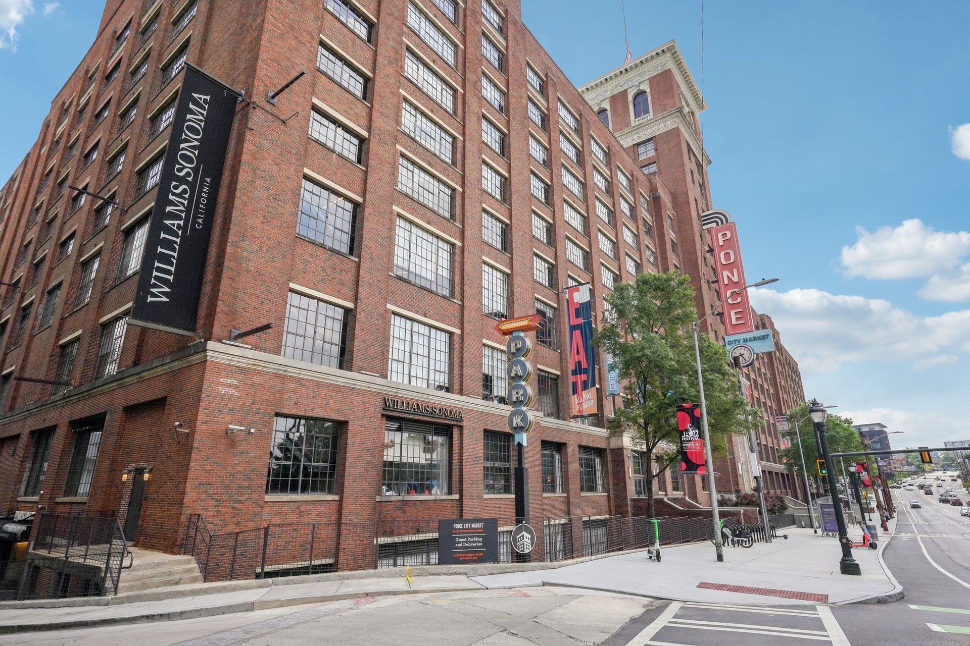 Brick building, Williams Sonoma sign, street view, sunny day.