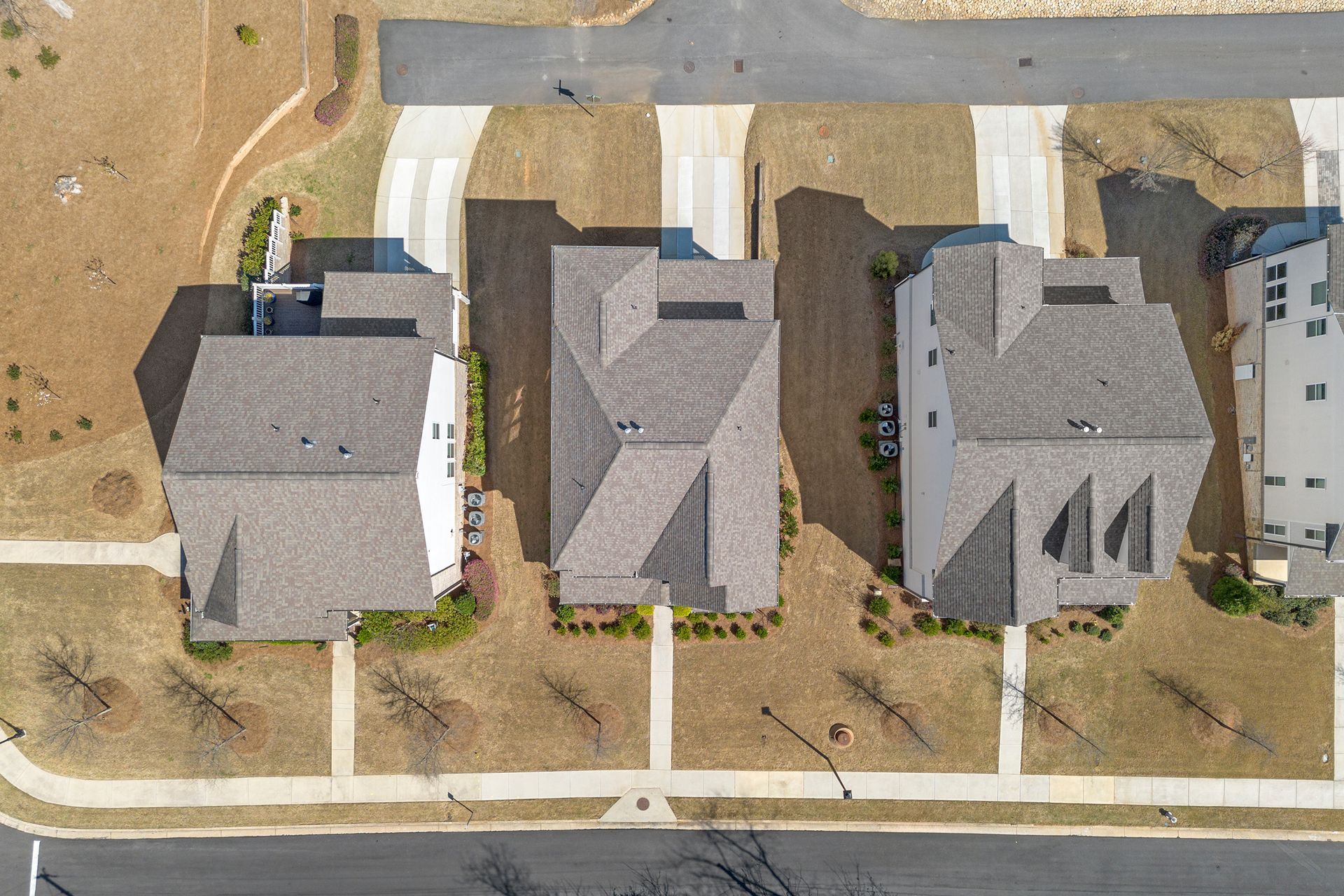 An aerial view of a row of houses in a residential area.