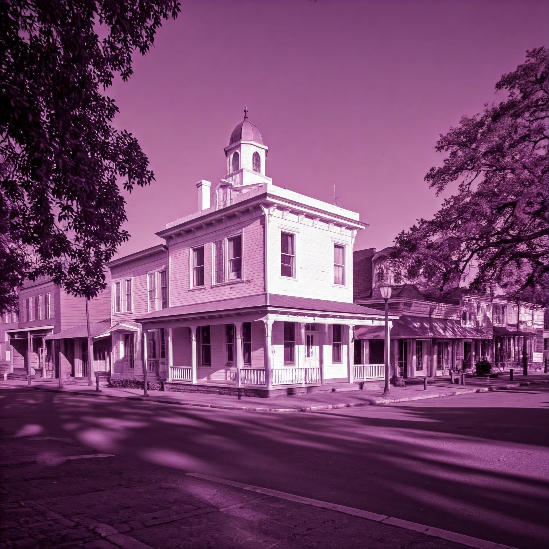 A large white building with a dome on top of it