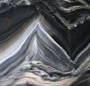Swirling pattern of dark gray, white, and tan colors, resembling layered rock formations.