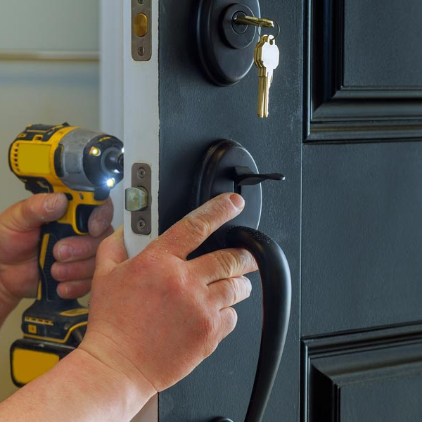 South Bend — Man Installing a New Door Lock in South Bend, IN