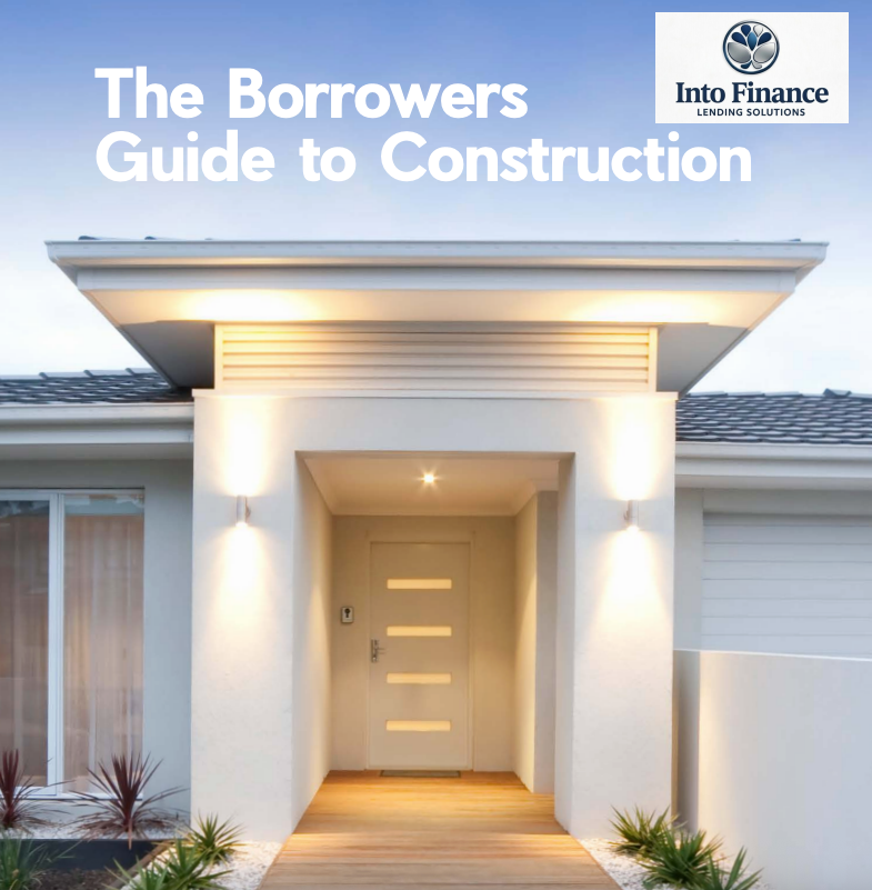 Two People at a Desk Review Documents and Calculations — Into Finance Lending Solutions in Coomba Bay, NSW