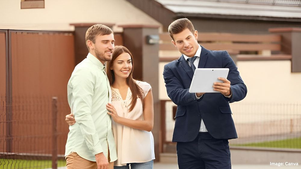 Real Estate Agent Showing House to Couple, Holding Tablet Outside — Into Finance Lending Solutions in Coomba Bay, NSW