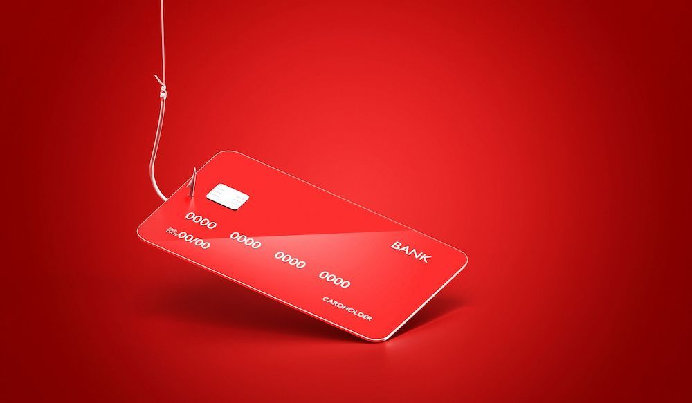 Red Credit Card Suspended on a Fishhook, Against a Red Background — Into Finance Lending Solutions in Tuncurry, NSW