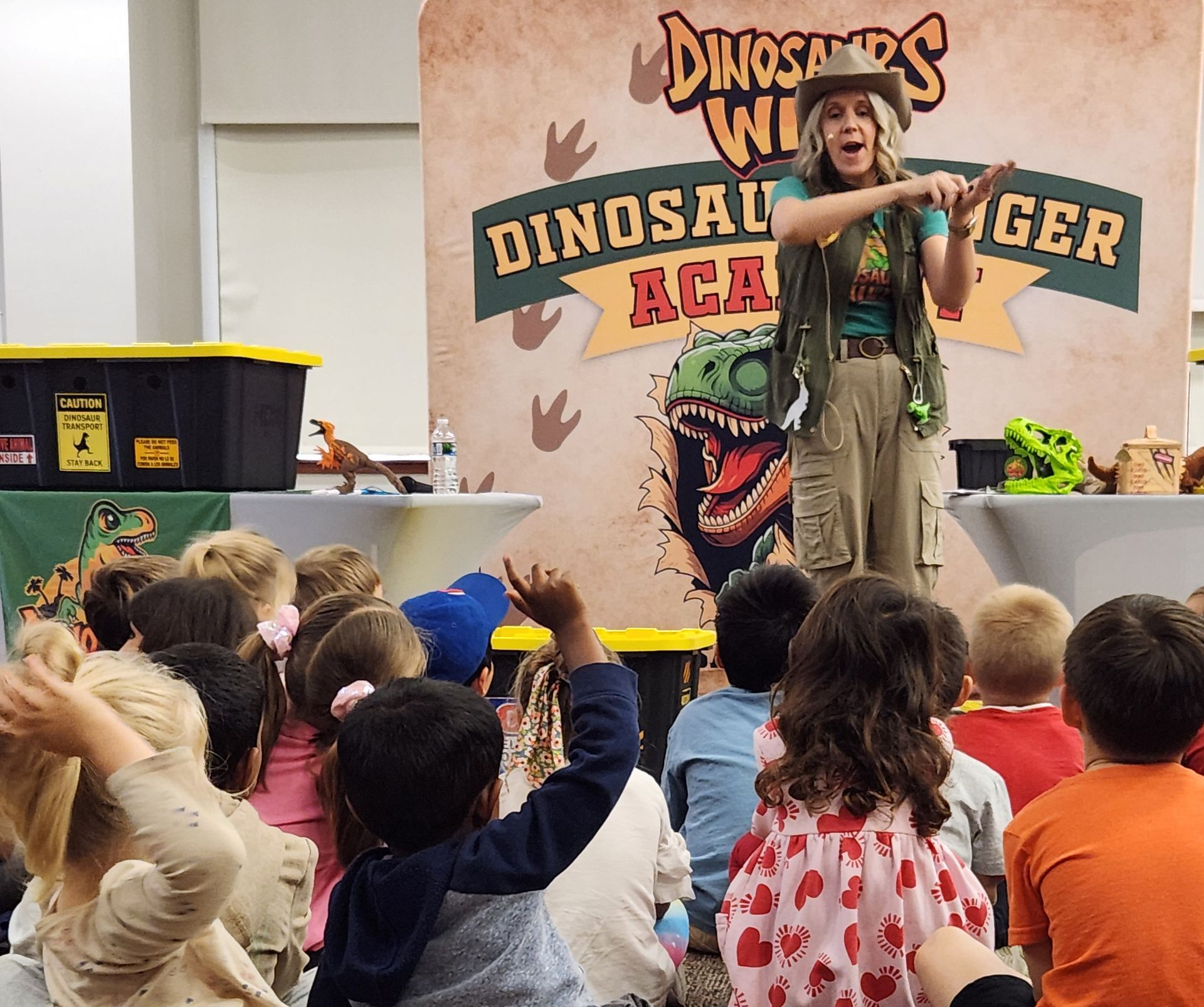 Dinosaur meets boy at the library