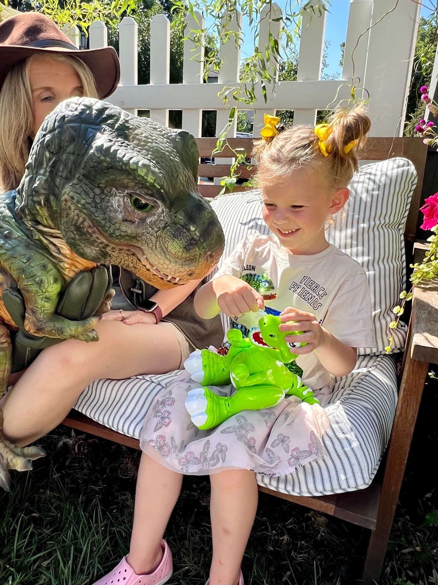 Dinoaur meets smiling girl