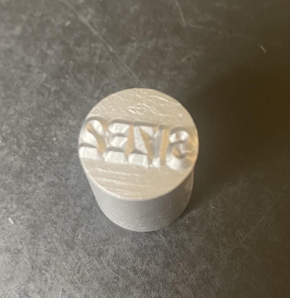 Metal stamp with 