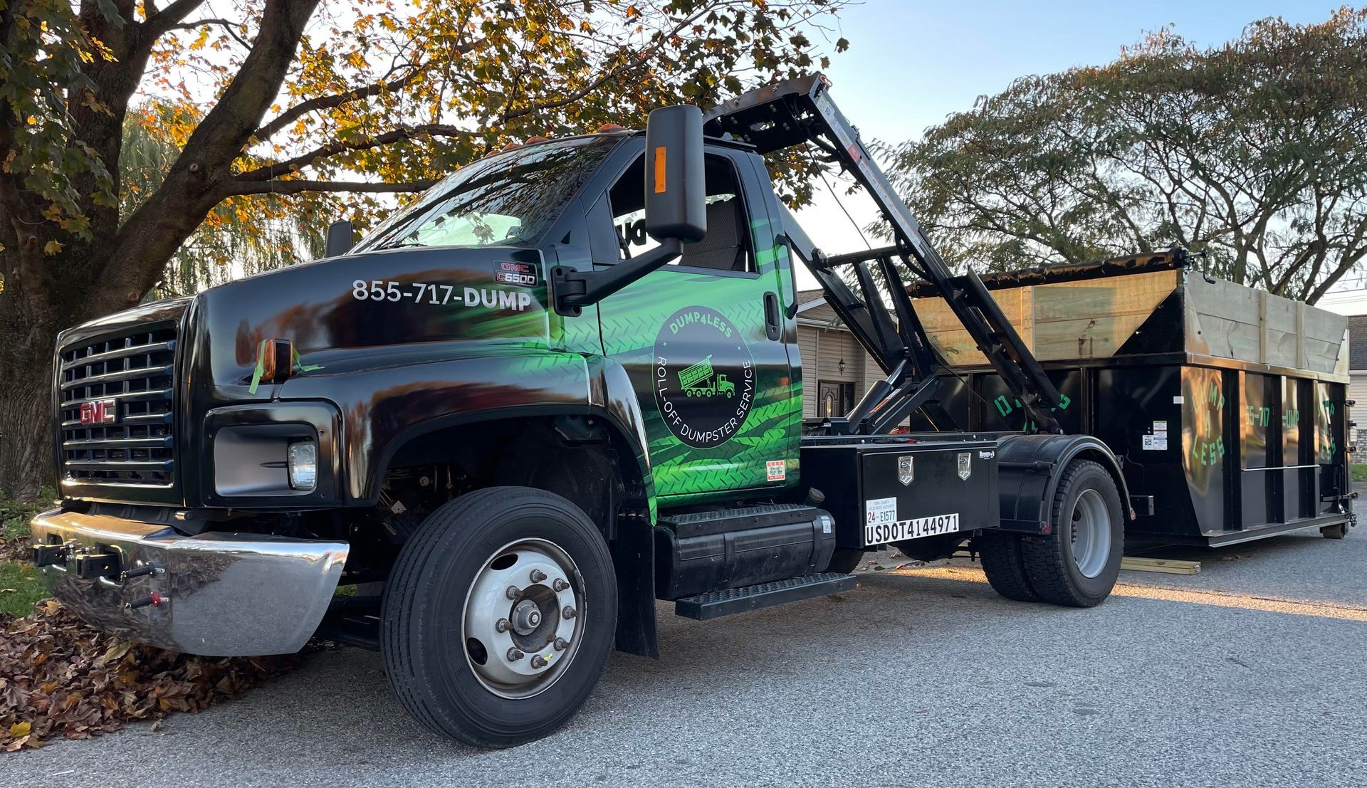 a dump truck is parked on the side of the road