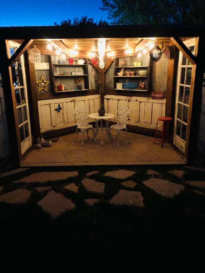 Two White Metal Chairs In A Night View — Lincoln, NE — Dreamscapes Inc.