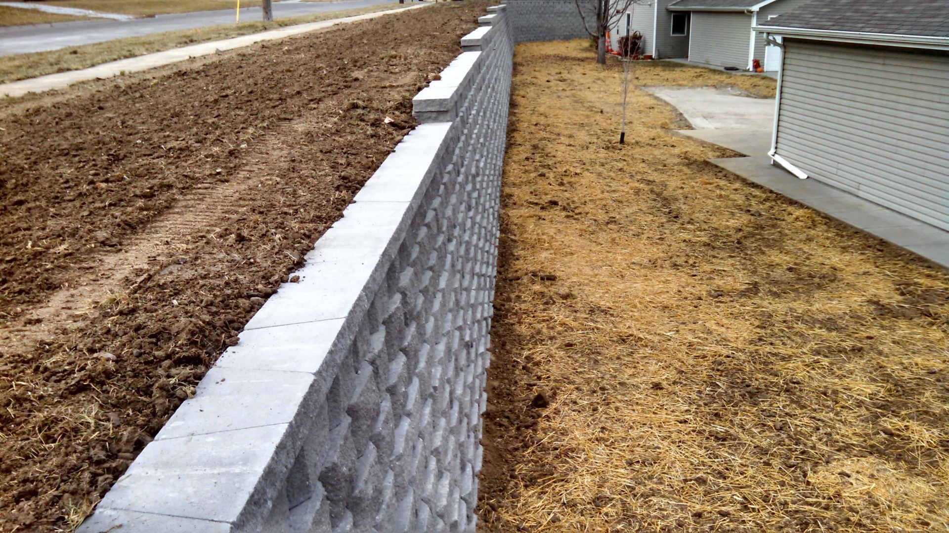 Commercial Stone Wall Straight View — Lincoln, NE — Dreamscapes Inc.