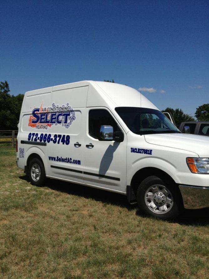 A white van with the word select on the side