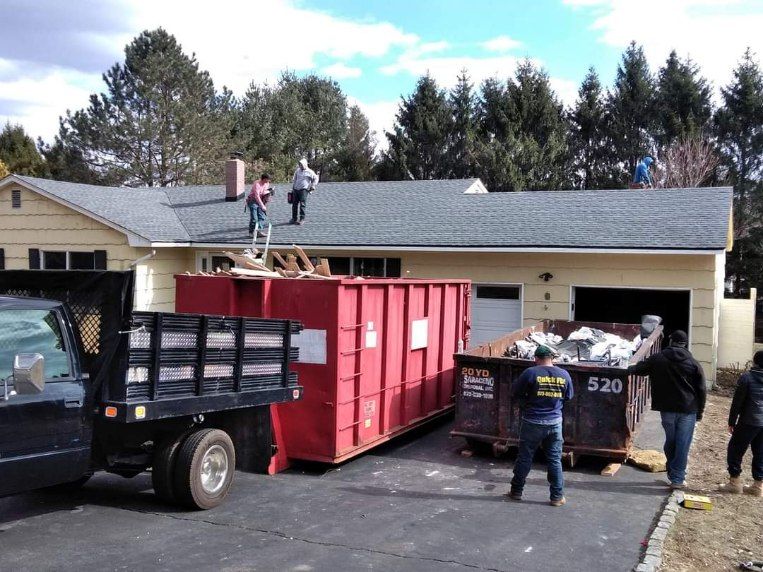 A dumpster that has the number 520 on it