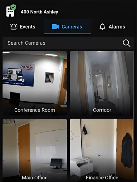 Screenshot of a security camera app showing live feeds from conference room, corridor, main office, and finance office.