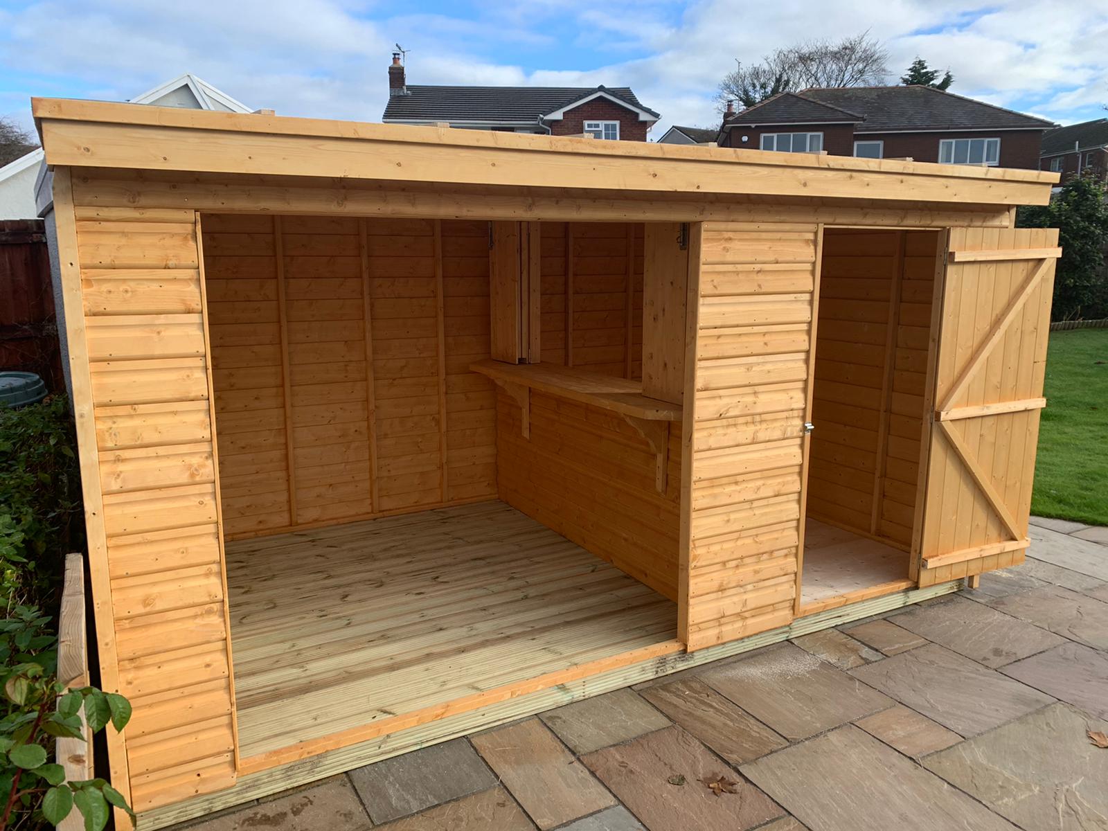 A pent roof bar and serving hatch with an additional decked area undercover which could have people or even a hot tub. 