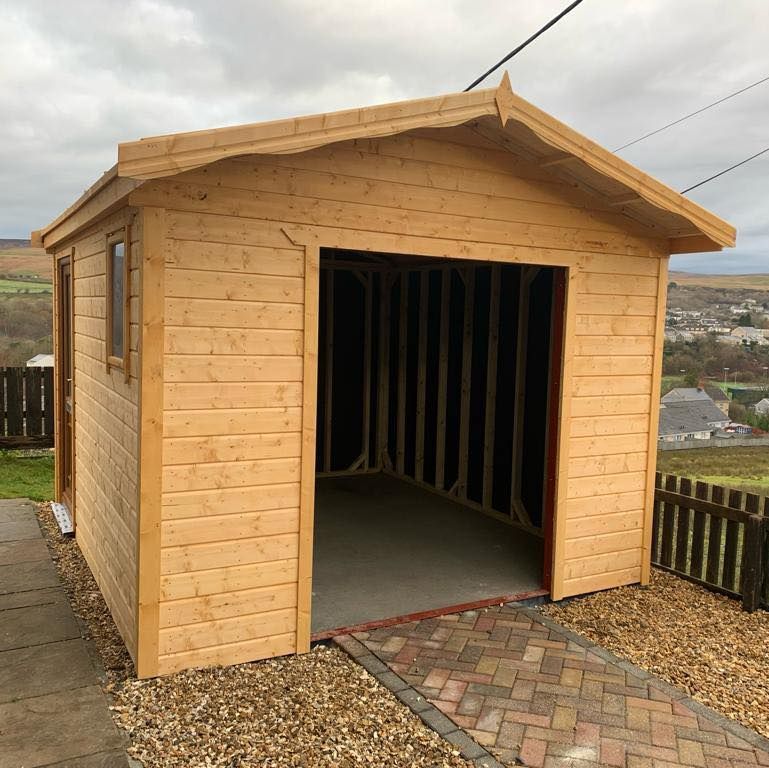 10' x 12' workshop as a garage with PVC. Framework is 44mm x 70mm. From the front