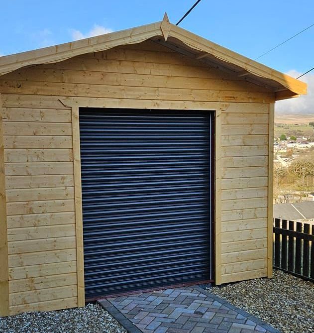 10' x 12' workshop as a garage with PVC. Framework is 44mm x 70mm.  Completed with the roller shutter doors installed by another company.