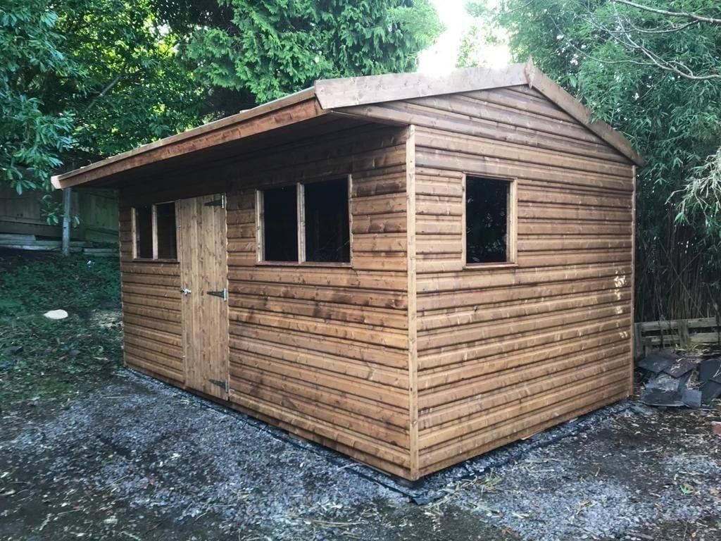 16' x 10' Workshop with door in middle, windows either side then window on the side.