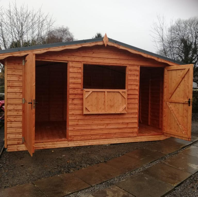 A 14' x 10' shed with two doors and a drop down window.