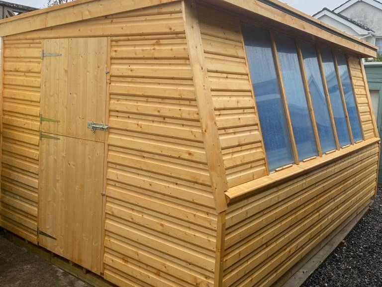 14' x 8' Potting shed. Should have 7 panes of Perspex but the customer wanted the two edge ones blocked off. This was done.