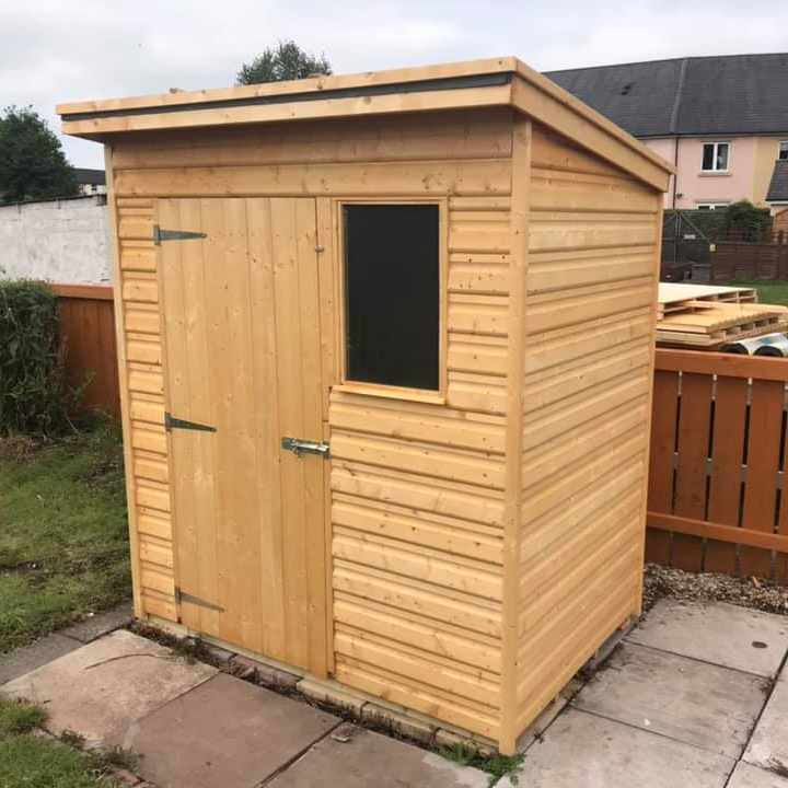 6'x4' pent shed with door to the left and window on the right.