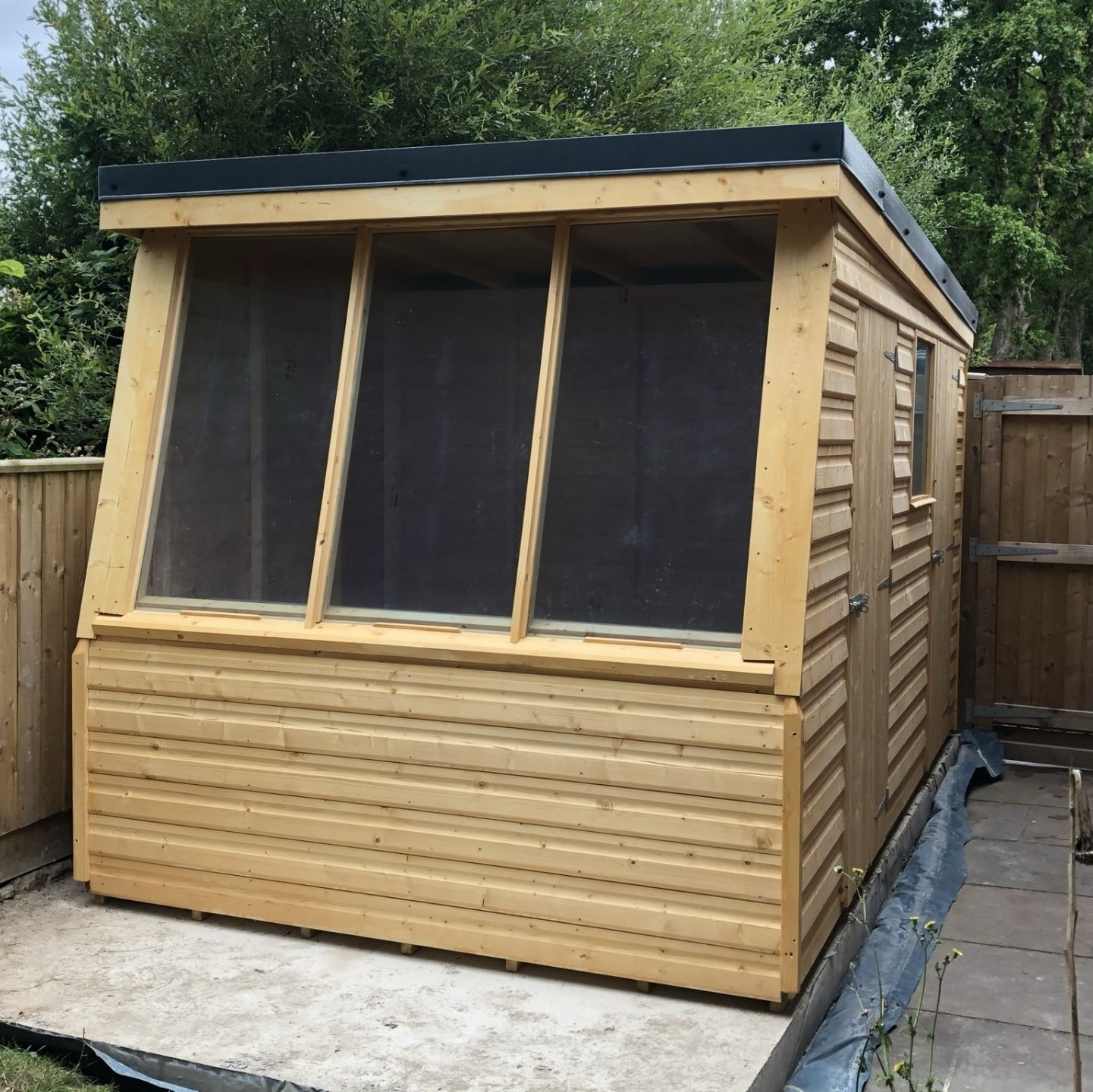 7' x 12' Potting shed combined with storage shed at the back and metal box profile sheets on the roof.