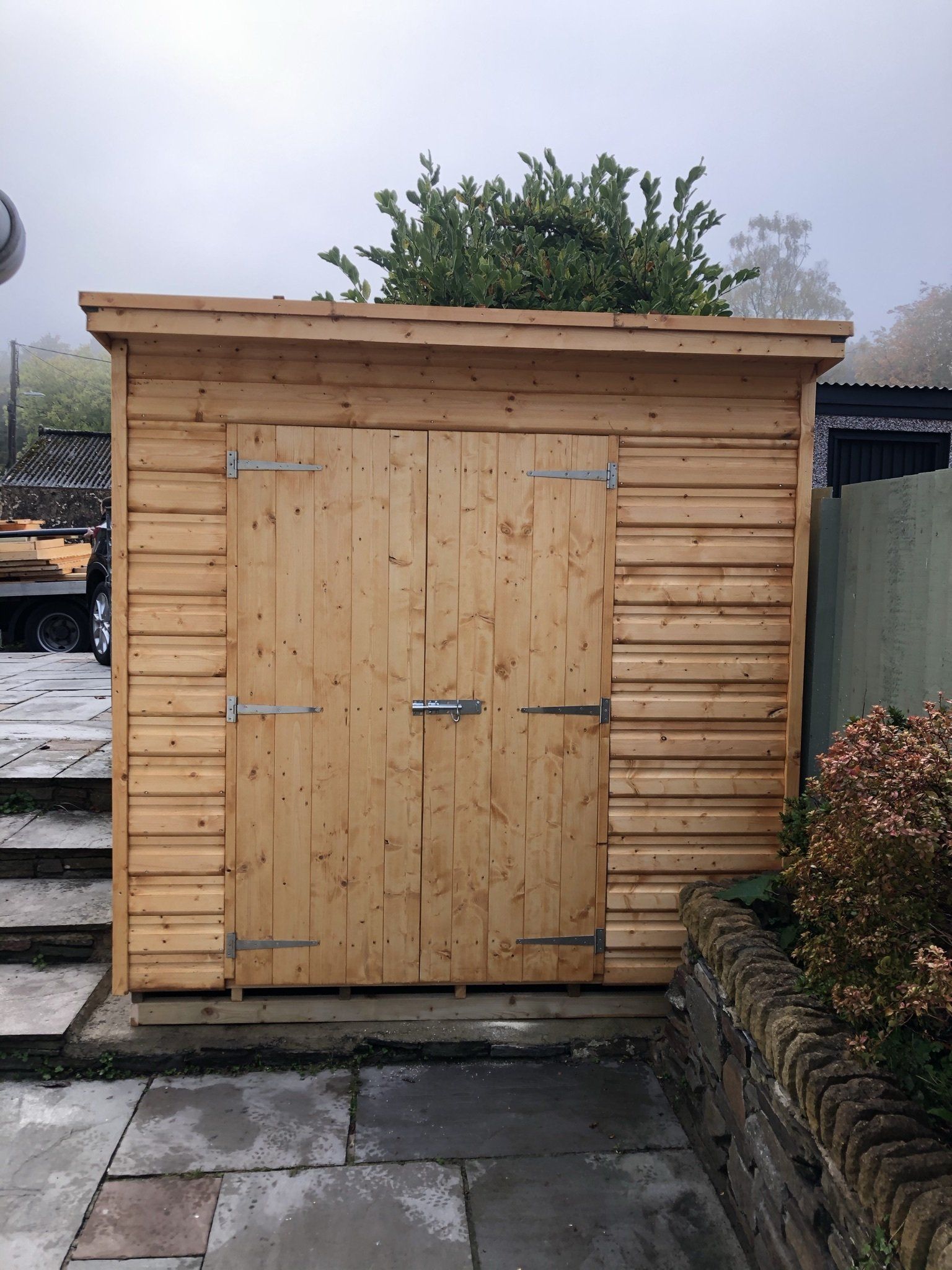 Shed height storage with double doors.